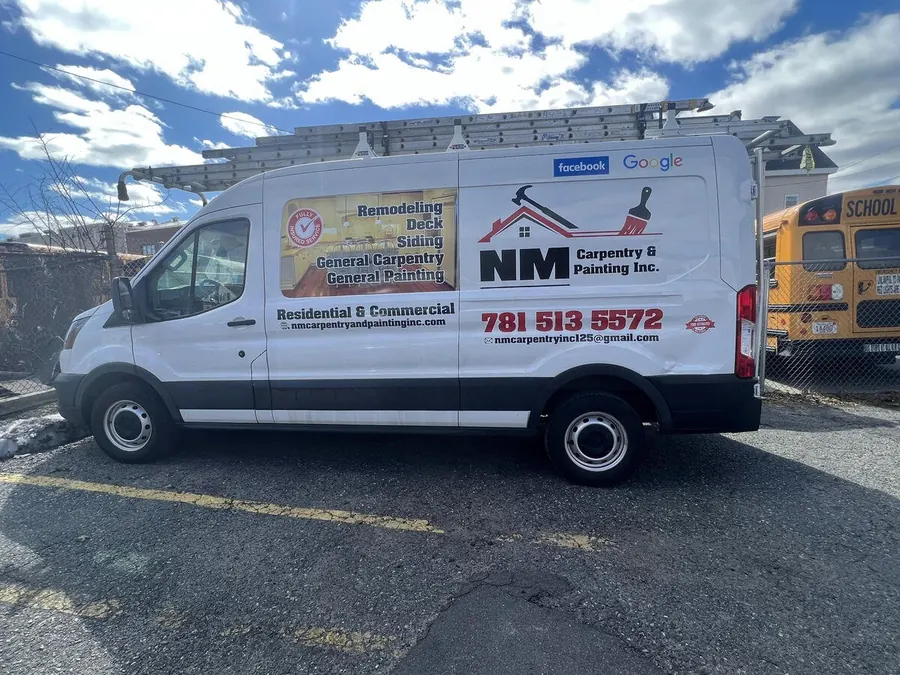 NM Carpentry and Painting van on a job