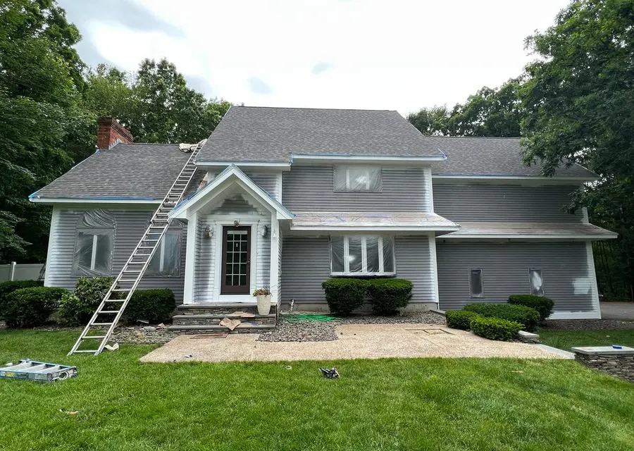 Colonial home with fresh gray siding and white trim