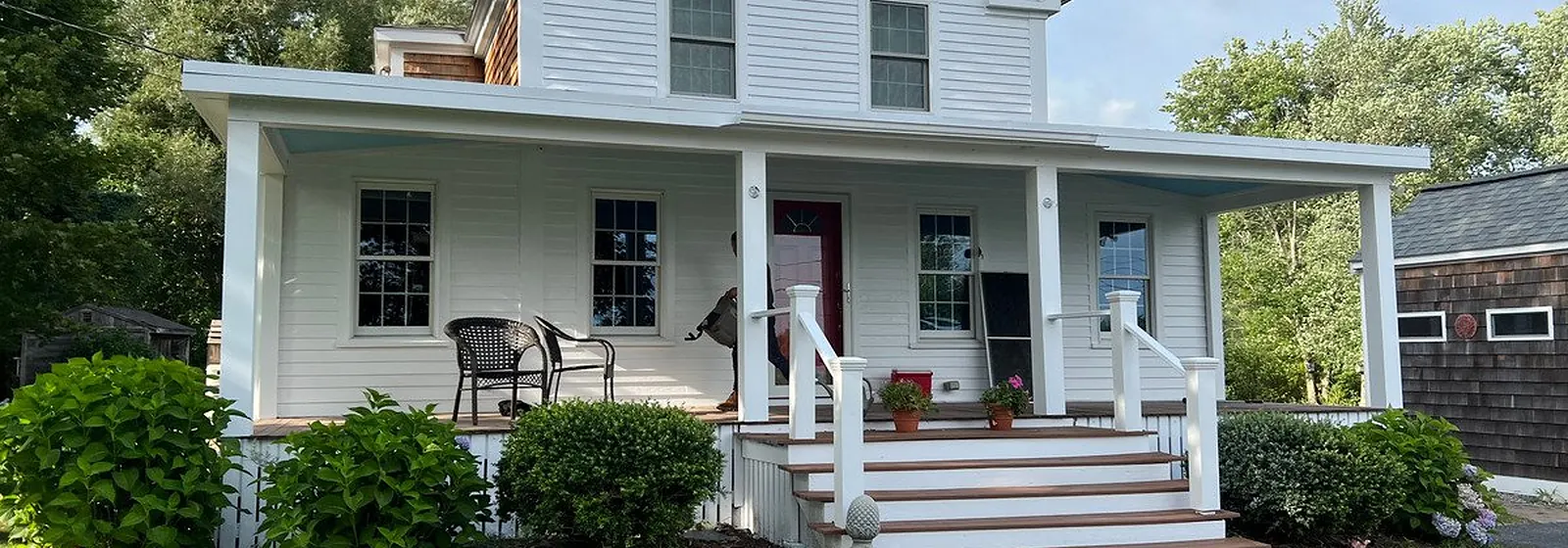 White farmhouse with a freshly painted porch