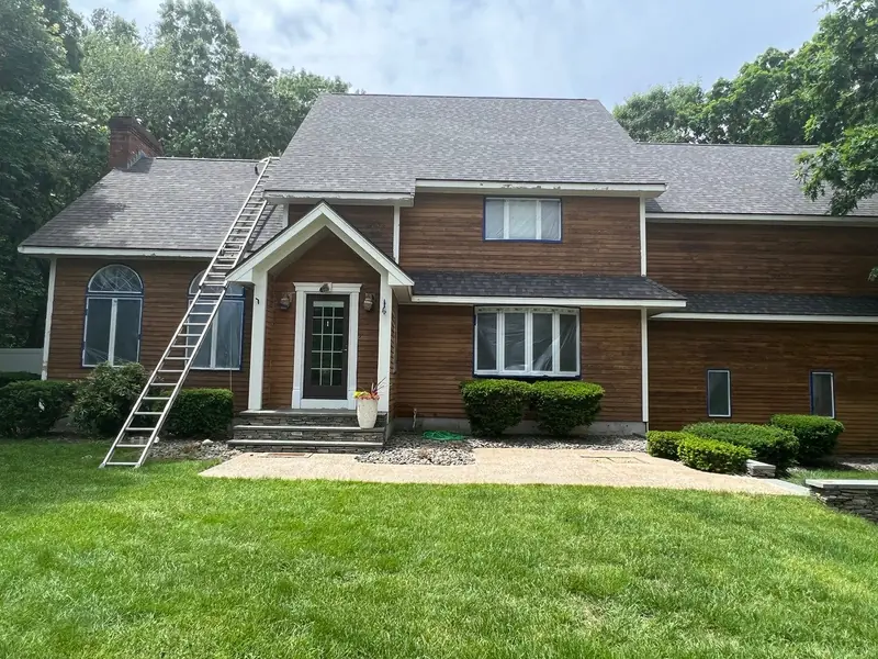 Home with new cedar shingle siding and a new roof