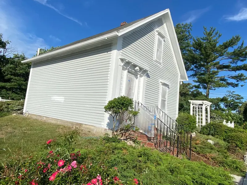 White clapboard home with a fresh coat of paint